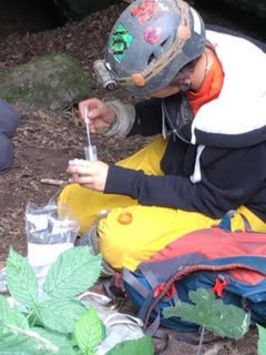 Collecting a sample at Bloody Bones Cave